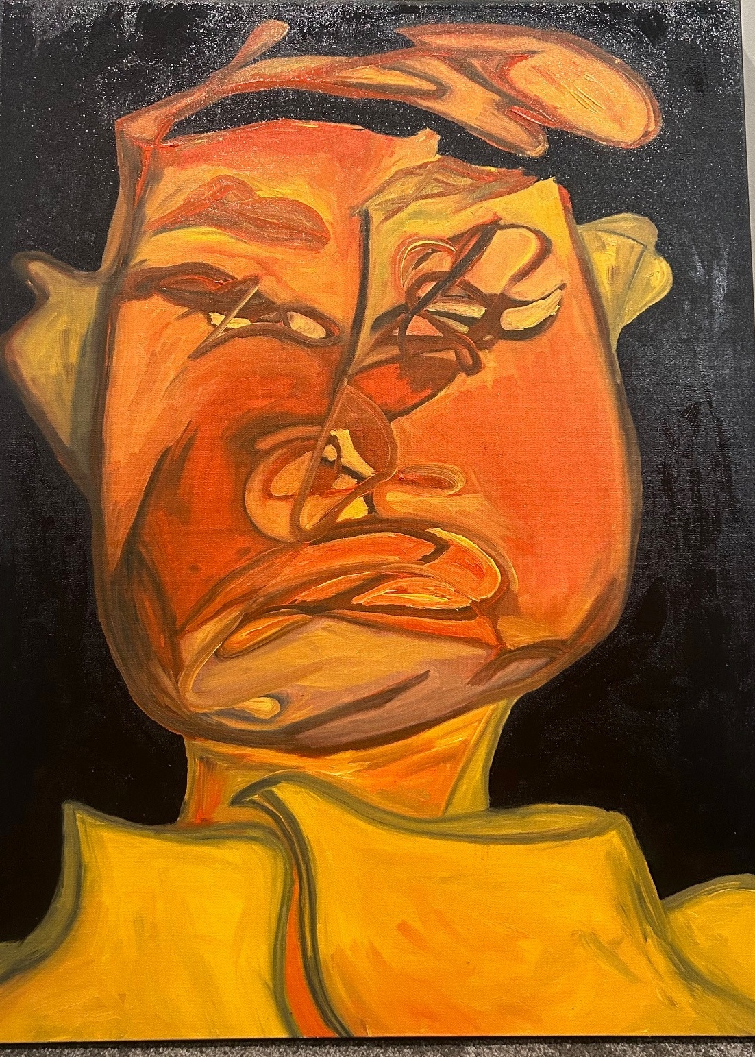 Orange face against a dark ground